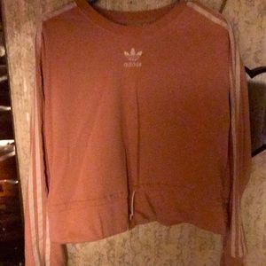 Pink Adidas sweatshirt with draw strings at the bottom. It was only worn once.